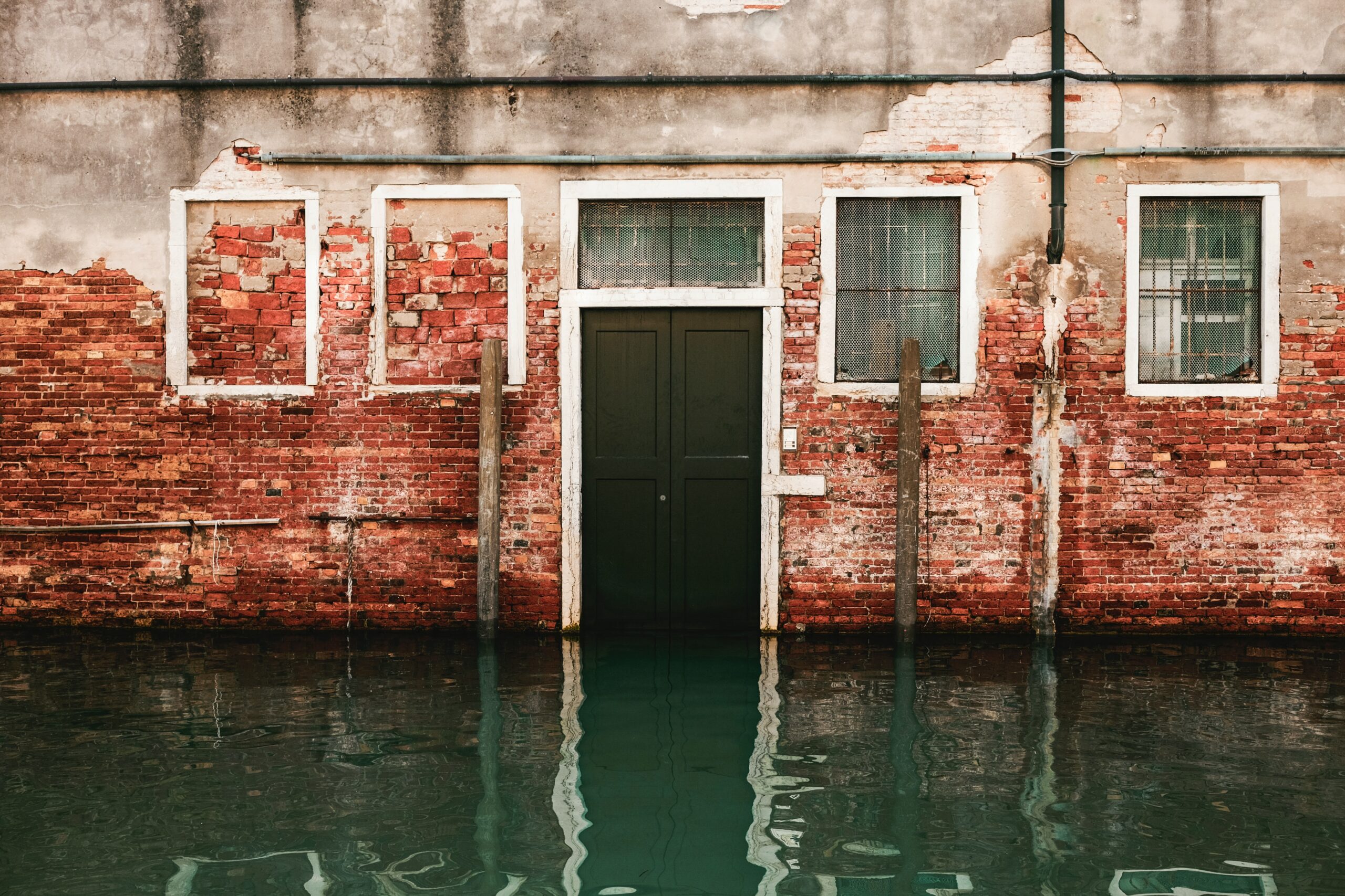 building with door and windows flooded